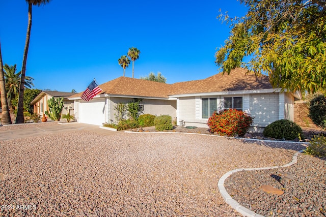 single story home with a garage