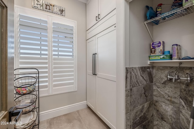 interior space with light tile patterned floors