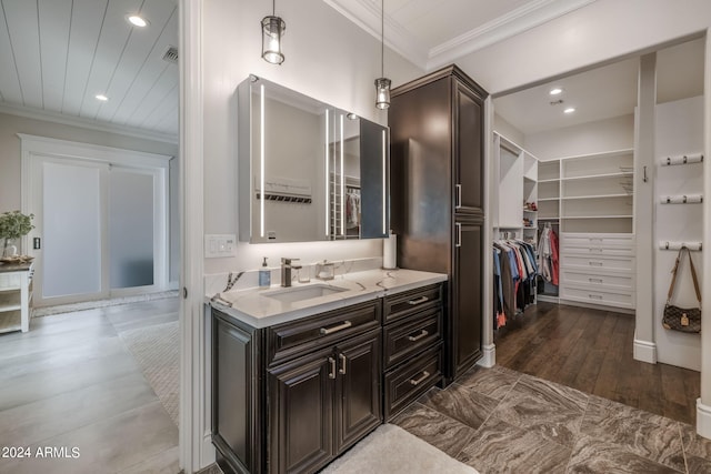 bathroom featuring vanity and ornamental molding