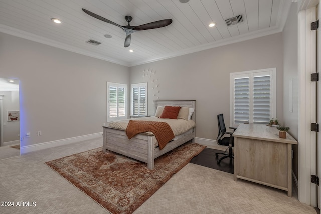 carpeted bedroom with ceiling fan, crown molding, and wood ceiling