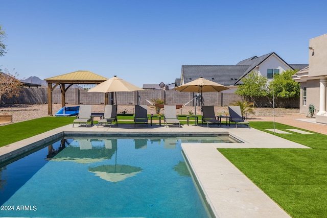 view of pool featuring a gazebo, a yard, and a patio area