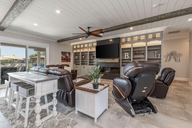 living room with beam ceiling, built in shelves, ceiling fan, and wooden ceiling