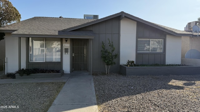 4217 W Medlock Dr, Phoenix, AZ 85019 - doorway to property with roof with shingles