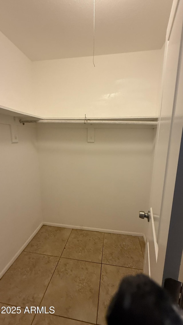 4217 W Medlock Dr, Phoenix, AZ 85019 - spacious closet featuring tile patterned flooring