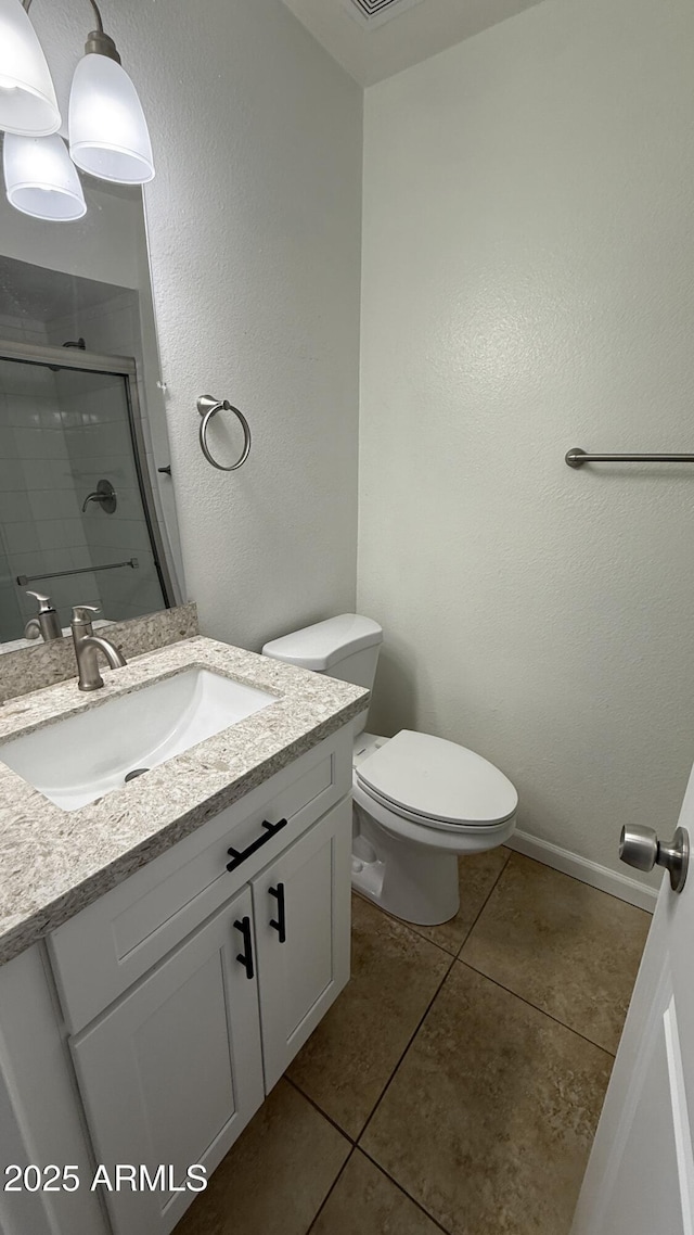 4217 W Medlock Dr, Phoenix, AZ 85019 - full bath featuring vanity, tile patterned flooring, and a shower stall