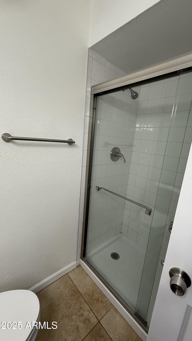 4217 W Medlock Dr, Phoenix, AZ 85019 - bathroom featuring a stall shower and tile patterned floors