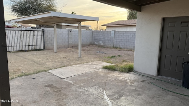 4217 W Medlock Dr, Phoenix, AZ 85019 - patio terrace at dusk with a patio area and a fenced backyard