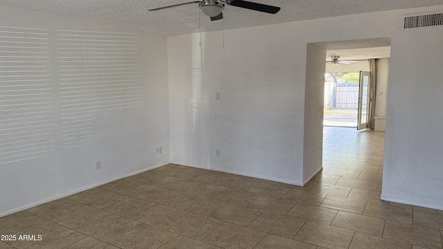 4217 W Medlock Dr, Phoenix, AZ 85019 - empty room with ceiling fan, a textured ceiling, and tile patterned flooring