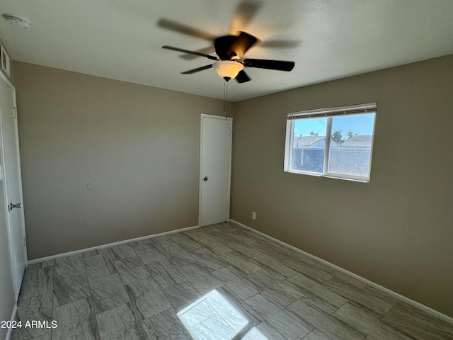 unfurnished room featuring ceiling fan