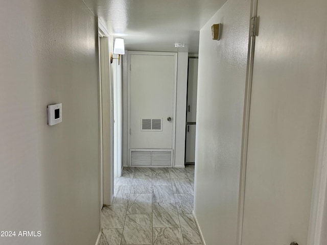 3637 W Myrtle Ave, Phoenix, AZ 85051 - hallway with light marble finish flooring and baseboards