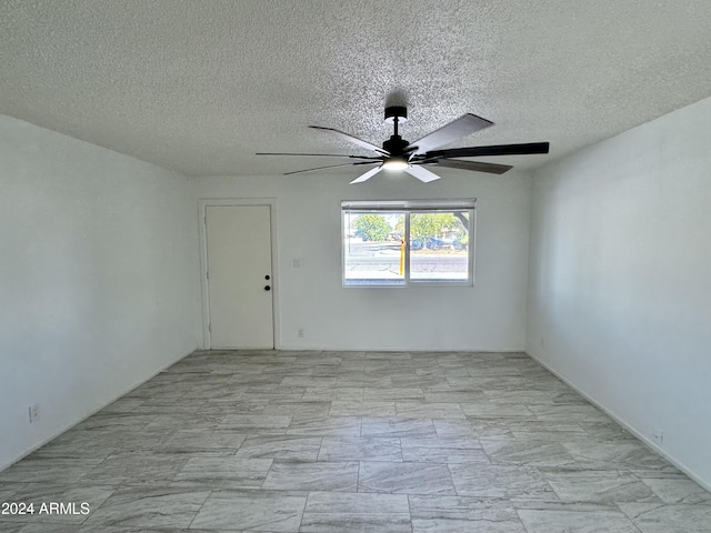 3637 W Myrtle Ave, Phoenix, AZ 85051 - spare room featuring ceiling fan and a textured ceiling
