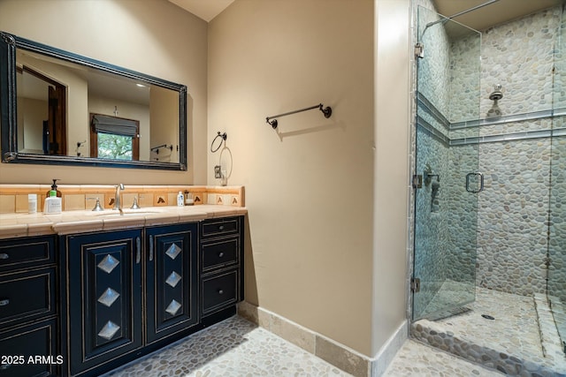 6102 E Sage Dr, Paradise Valley, AZ 85253 - bathroom with a stall shower, vanity, baseboards, and tile patterned flooring