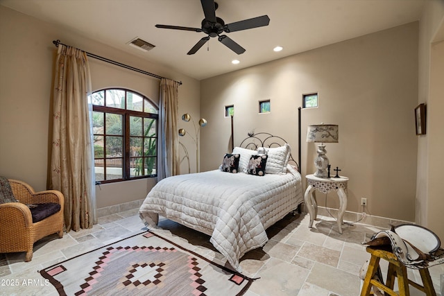 6102 E Sage Dr, Paradise Valley, AZ 85253 - bedroom with stone tile flooring, recessed lighting, baseboards, and ceiling fan
