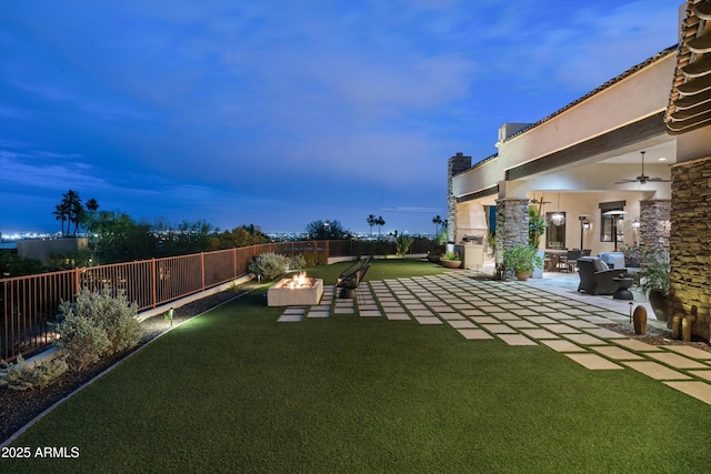 6102 E Sage Dr, Paradise Valley, AZ 85253 - view of yard featuring an outdoor fire pit, ceiling fan, and a patio