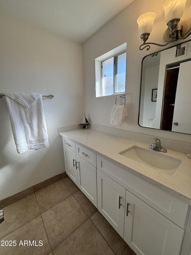 bathroom with vanity and tile patterned floors