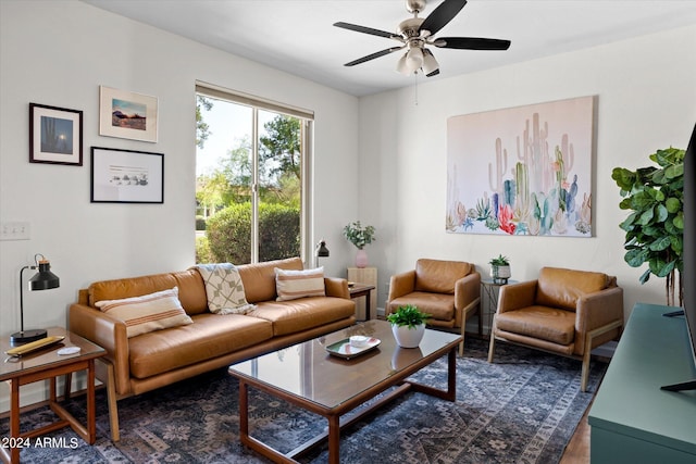 living room featuring dark hardwood / wood-style floors and ceiling fan