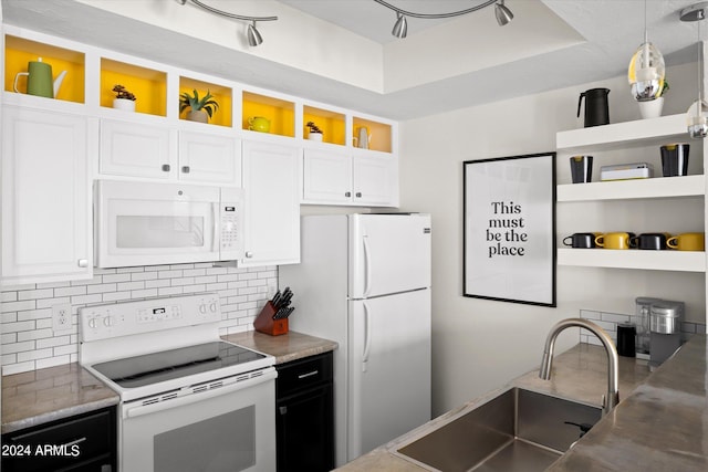 kitchen featuring sink, decorative light fixtures, white appliances, decorative backsplash, and white cabinets