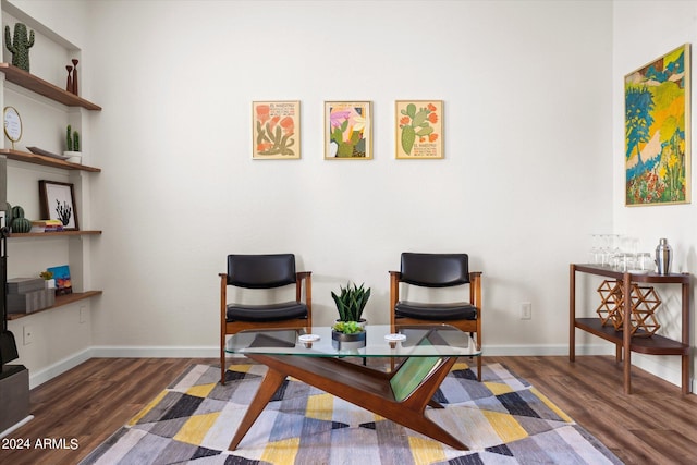 sitting room featuring dark hardwood / wood-style floors