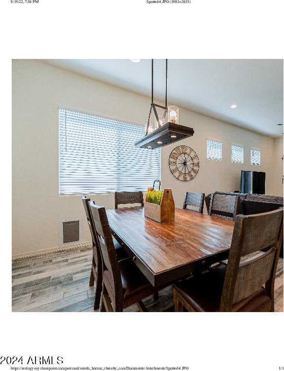 dining space with a healthy amount of sunlight and hardwood / wood-style flooring