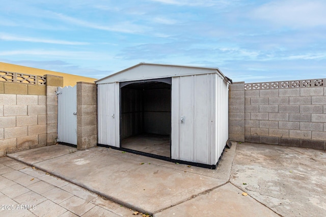 view of shed featuring a fenced backyard