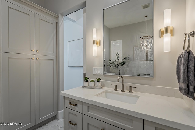 bathroom featuring vanity, tile patterned flooring, and visible vents