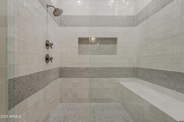 bathroom featuring tiled shower