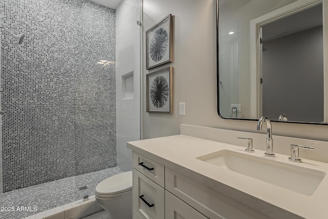 full bath featuring vanity, toilet, and a stall shower