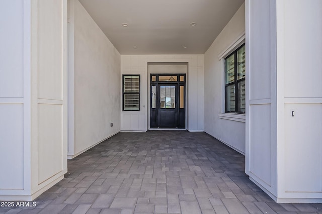entrance to property with a patio area