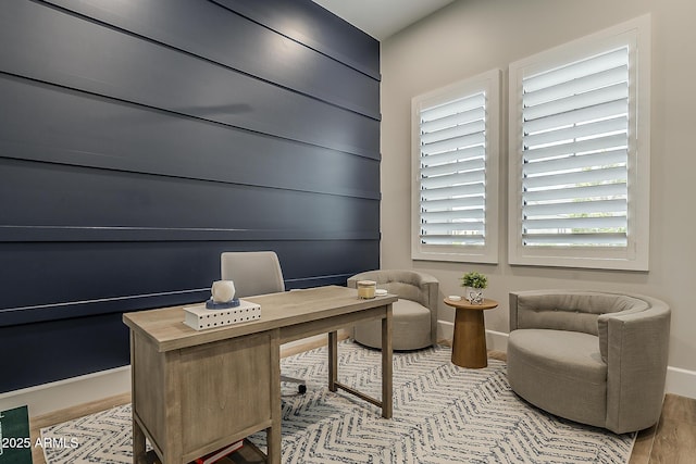 home office featuring light wood-type flooring and baseboards