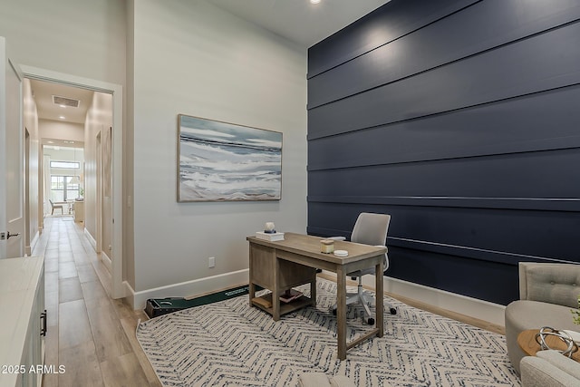 home office with recessed lighting, baseboards, visible vents, and light wood finished floors