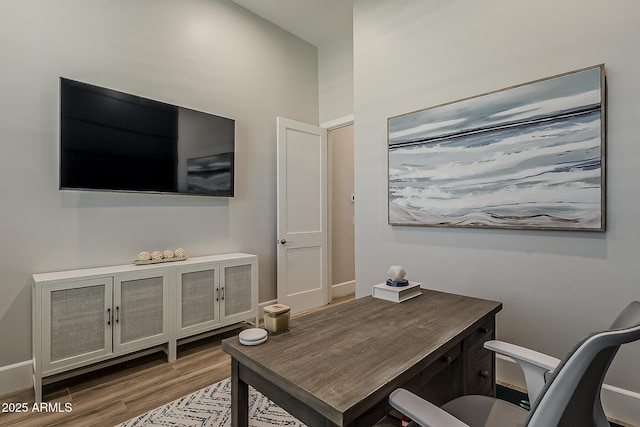 office space featuring wood finished floors