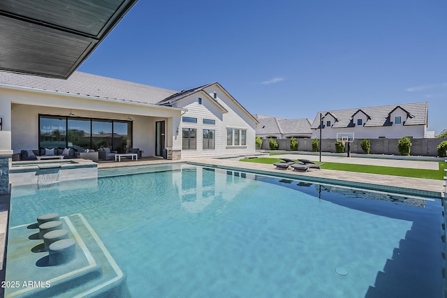 view of pool with a fenced in pool, fence, an outdoor hangout area, and a patio