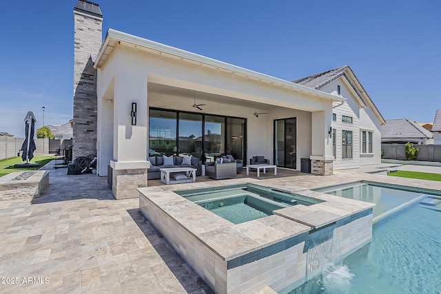 back of house featuring a fenced in pool, a patio, an in ground hot tub, and ceiling fan
