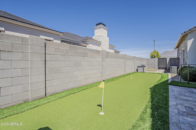 view of yard featuring a fenced backyard and cooling unit