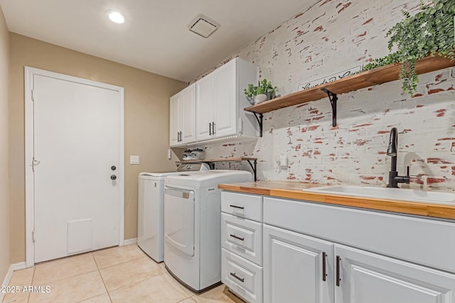 3514 E Desert Willow Rd, Phoenix, AZ 85044 - laundry room with cabinet space, independent washer and dryer, light tile patterned flooring, baseboards, and recessed lighting
