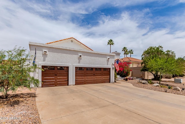 3514 E Desert Willow Rd, Phoenix, AZ 85044 - view of front of home with driveway, an attached garage, stucco siding, and a tiled roof