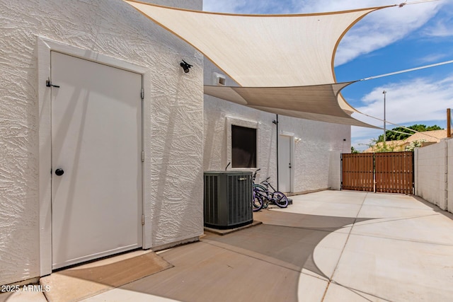 3514 E Desert Willow Rd, Phoenix, AZ 85044 - view of patio / terrace with central air condition unit and a gate