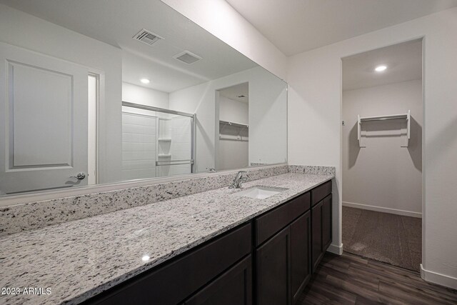 bathroom with wood-type flooring and vanity