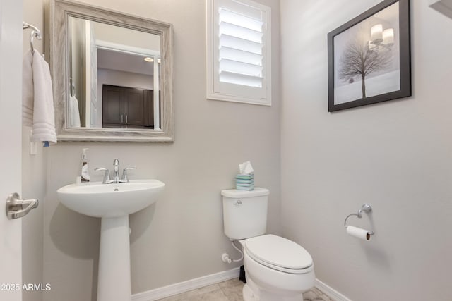 bathroom with toilet and sink