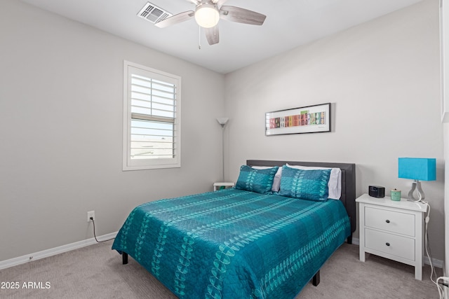 bedroom featuring light carpet and ceiling fan