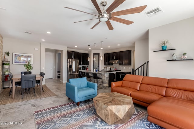 living room featuring ceiling fan