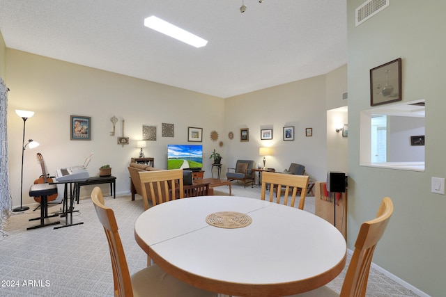 view of carpeted dining area