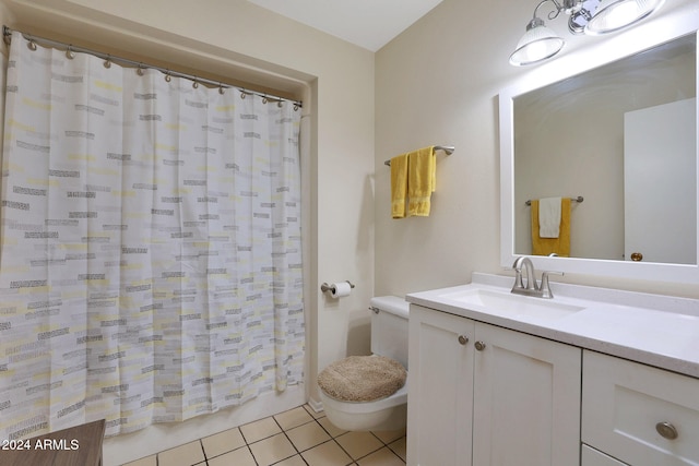 bathroom featuring tile patterned flooring, vanity, toilet, and a shower with shower curtain