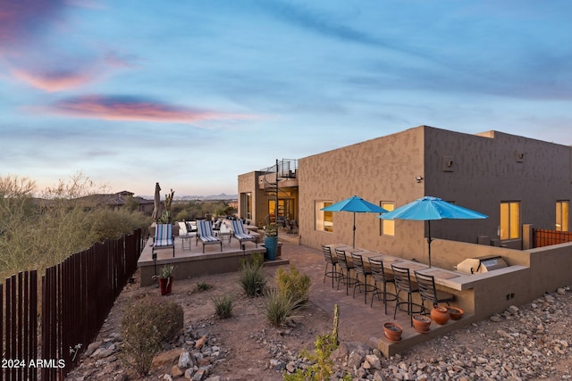 pool at dusk with a bar