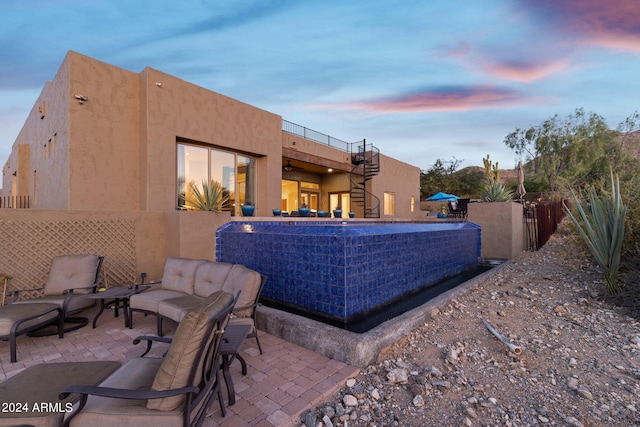 patio terrace at dusk with an outdoor living space