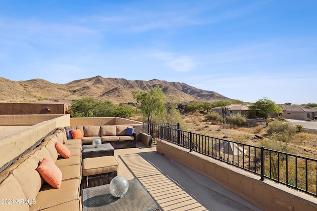 exterior space with a mountain view and an outdoor hangout area