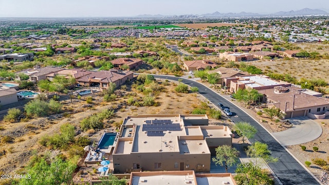 birds eye view of property featuring a mountain view