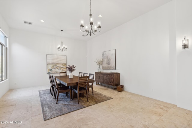 dining area featuring a notable chandelier