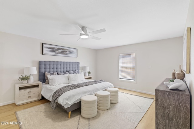 bedroom with ceiling fan and hardwood / wood-style floors