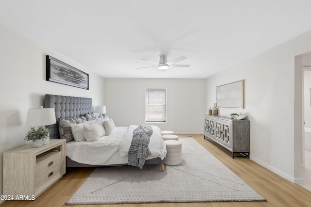 bedroom with ceiling fan and light wood-type flooring